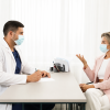 A patient and doctor in calm, face-to-face consultation.