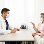 A patient and doctor in calm, face-to-face consultation.